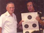Randy Schwartz presenting T. C. Rossman a target signed by BHRC members.